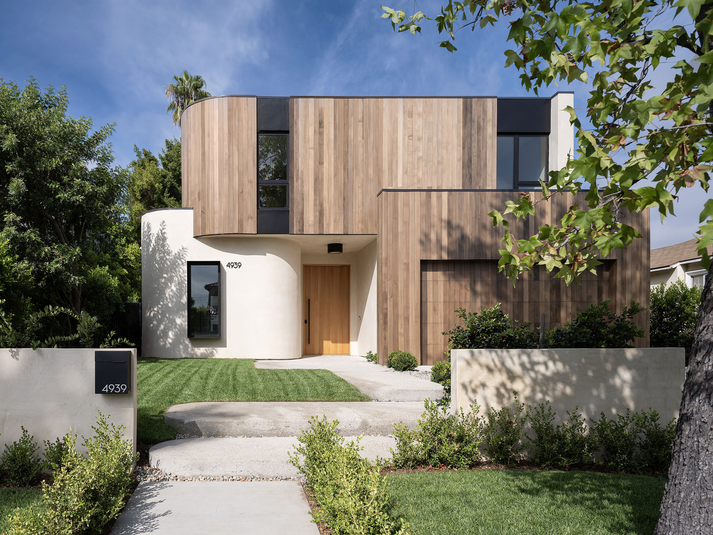 Clean minimal Cedar siding exterior of a contemporary custom house by Sabz Architecture Studio